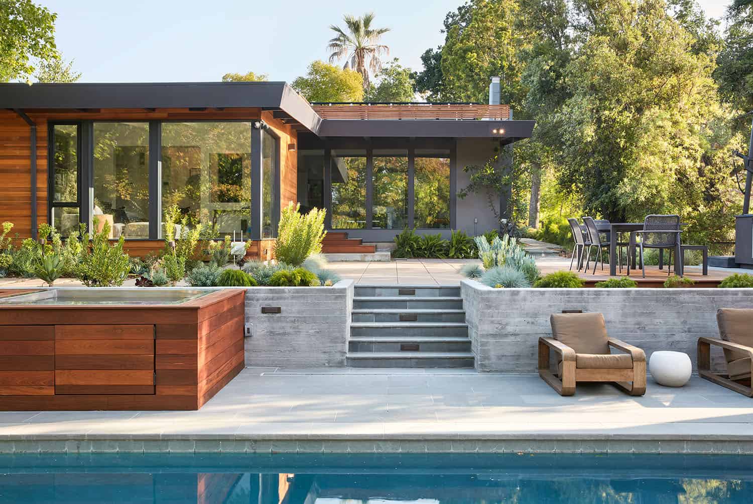 mid-century modern home exterior with a pool