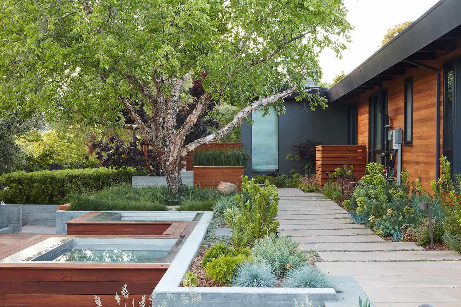 mid-century modern home exterior with a stepping stone walkway 