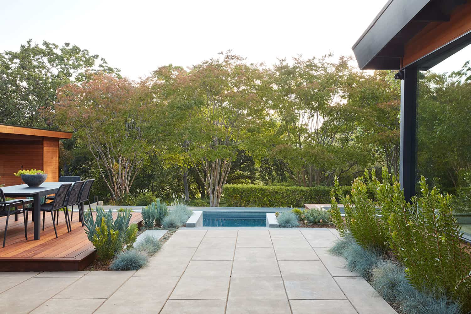 modern pool with a large patio