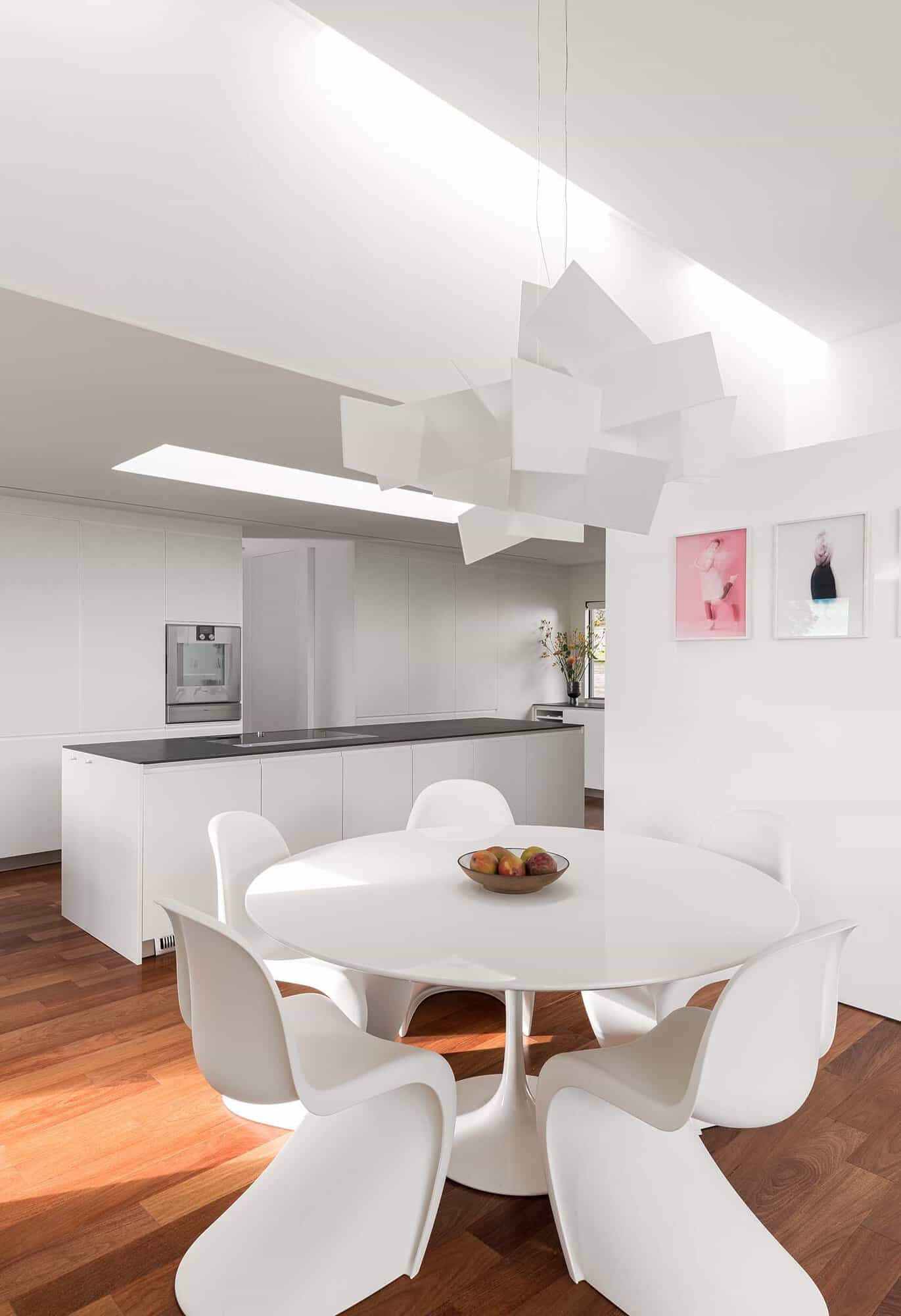 modern dining room with a view of the kitchen