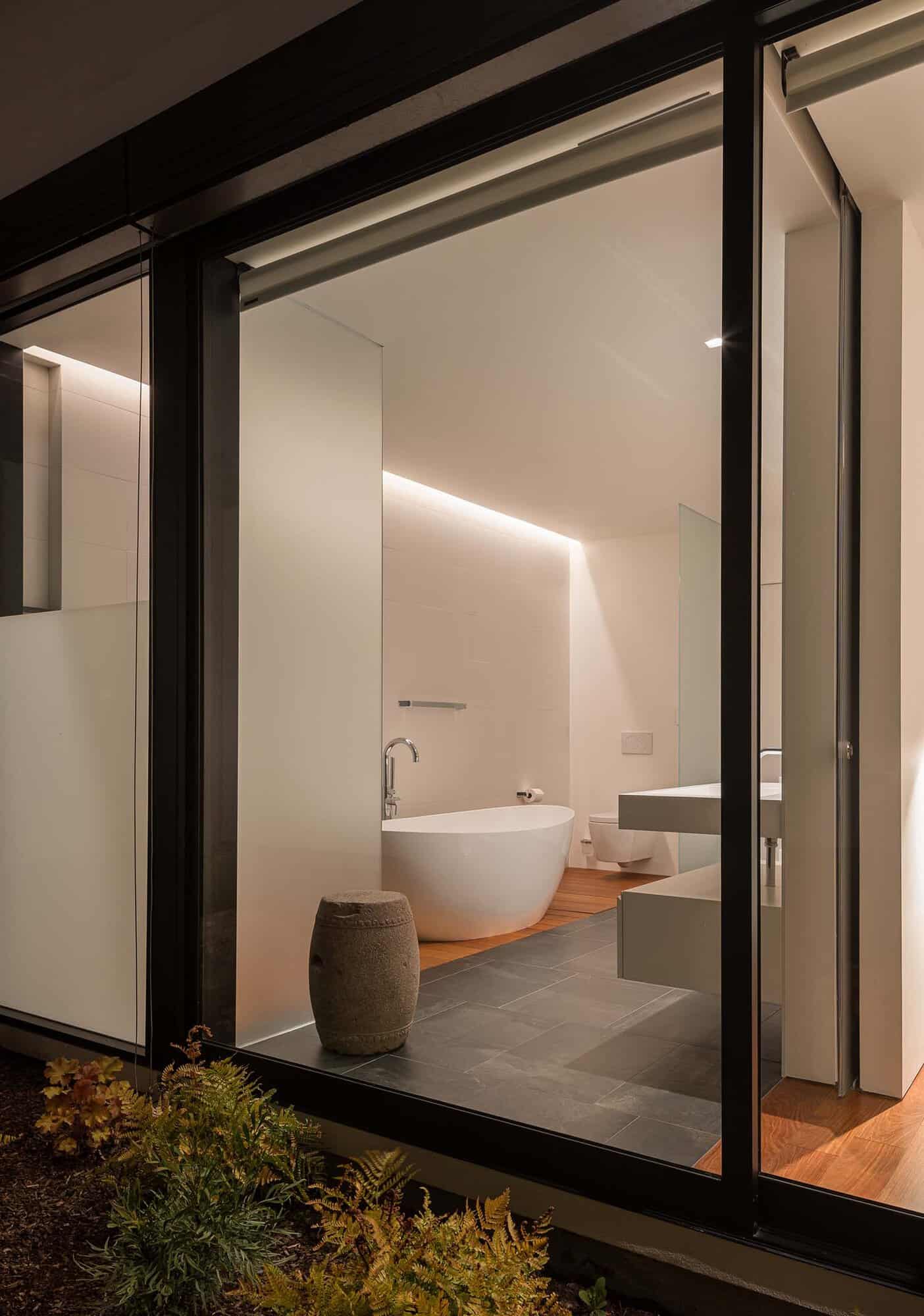 modern bathroom view through a sliding glass door