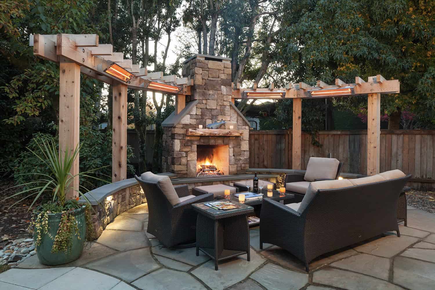 rustic patio with an outdoor fireplace 