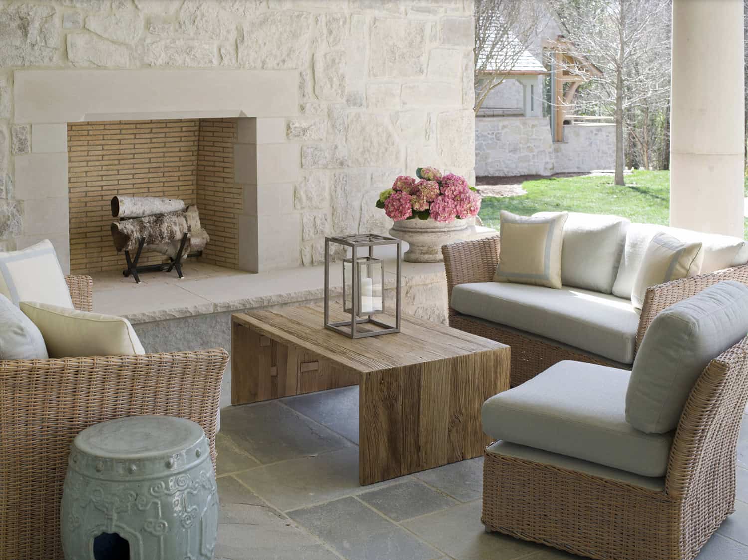 traditional style covered patio with a fireplace