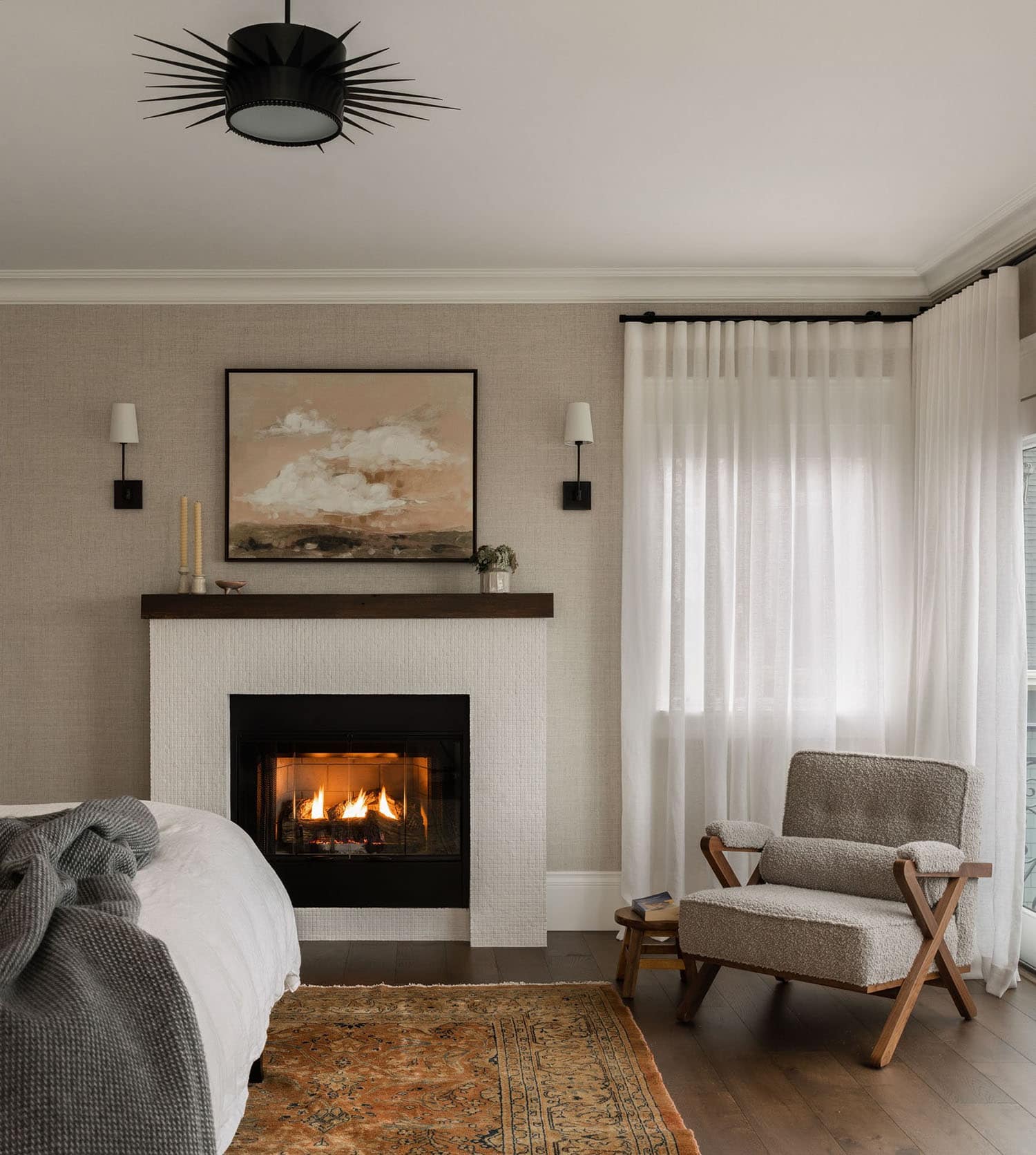 transitional style bedroom with a fireplace