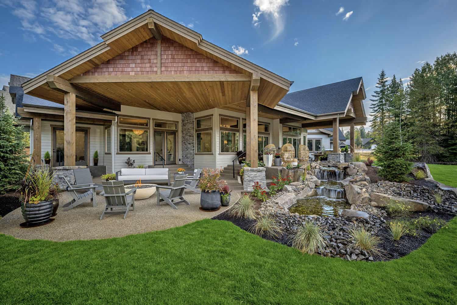 contemporary home backyard with a waterfall feature