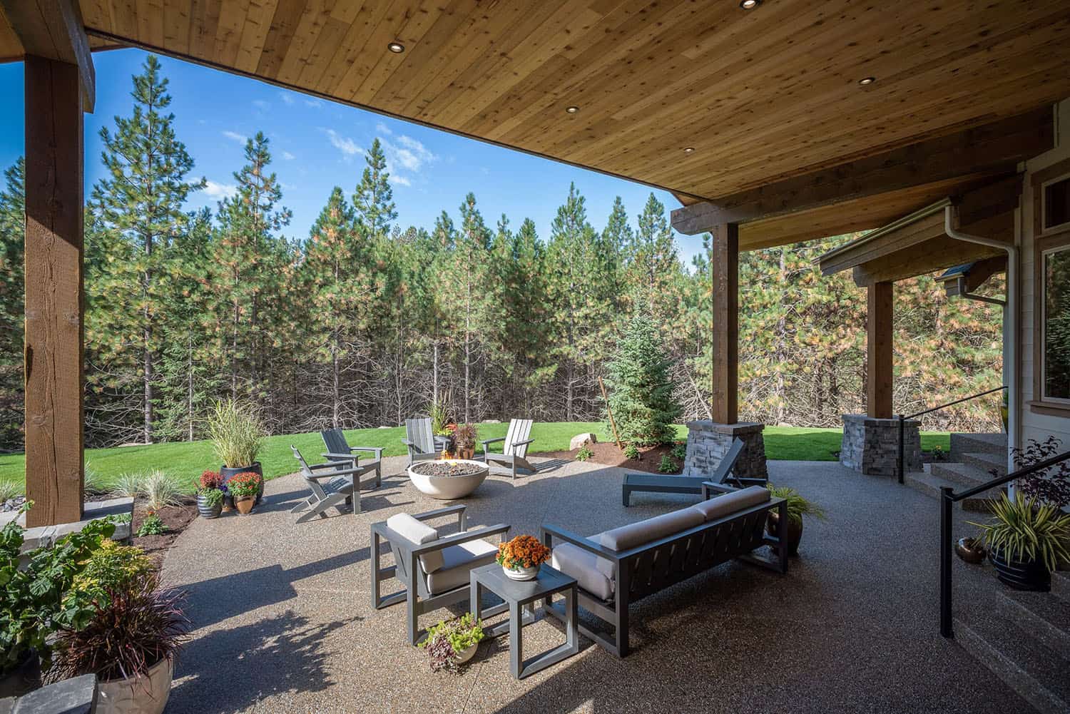 contemporary home backyard with a covered patio