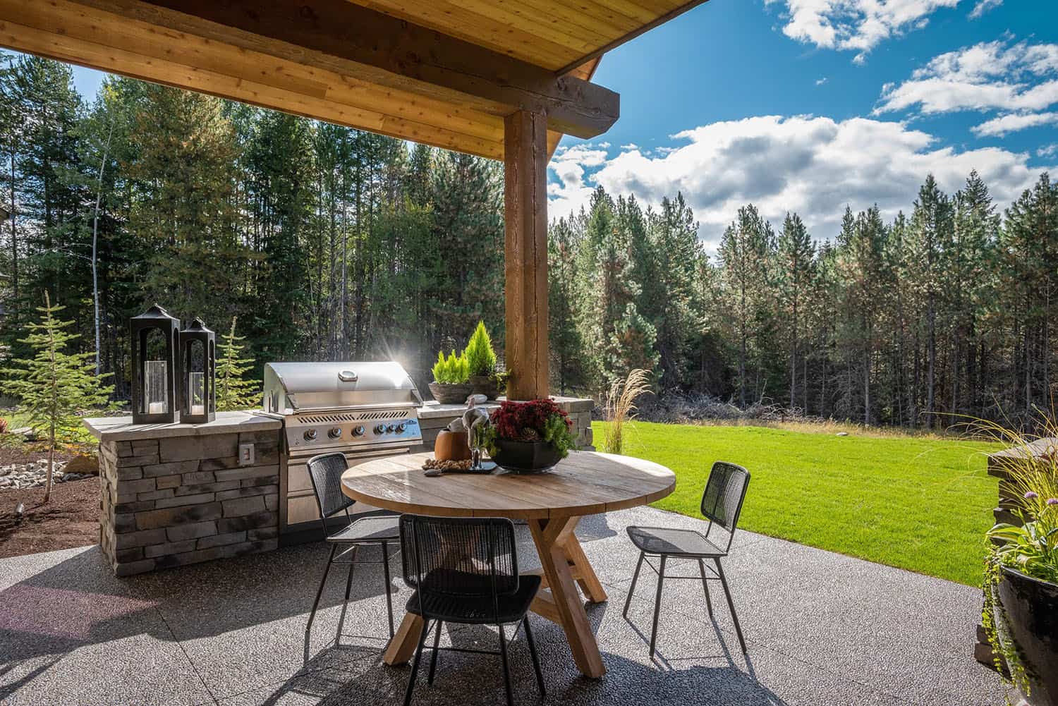 contemporary home backyard with a patio and alfresco dining