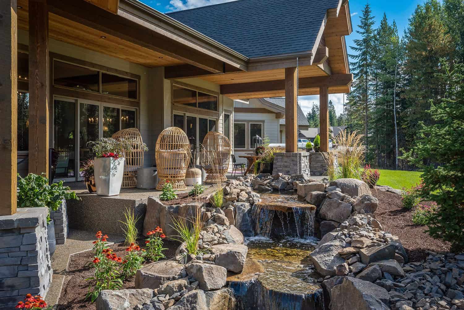 contemporary home backyard with a water feature