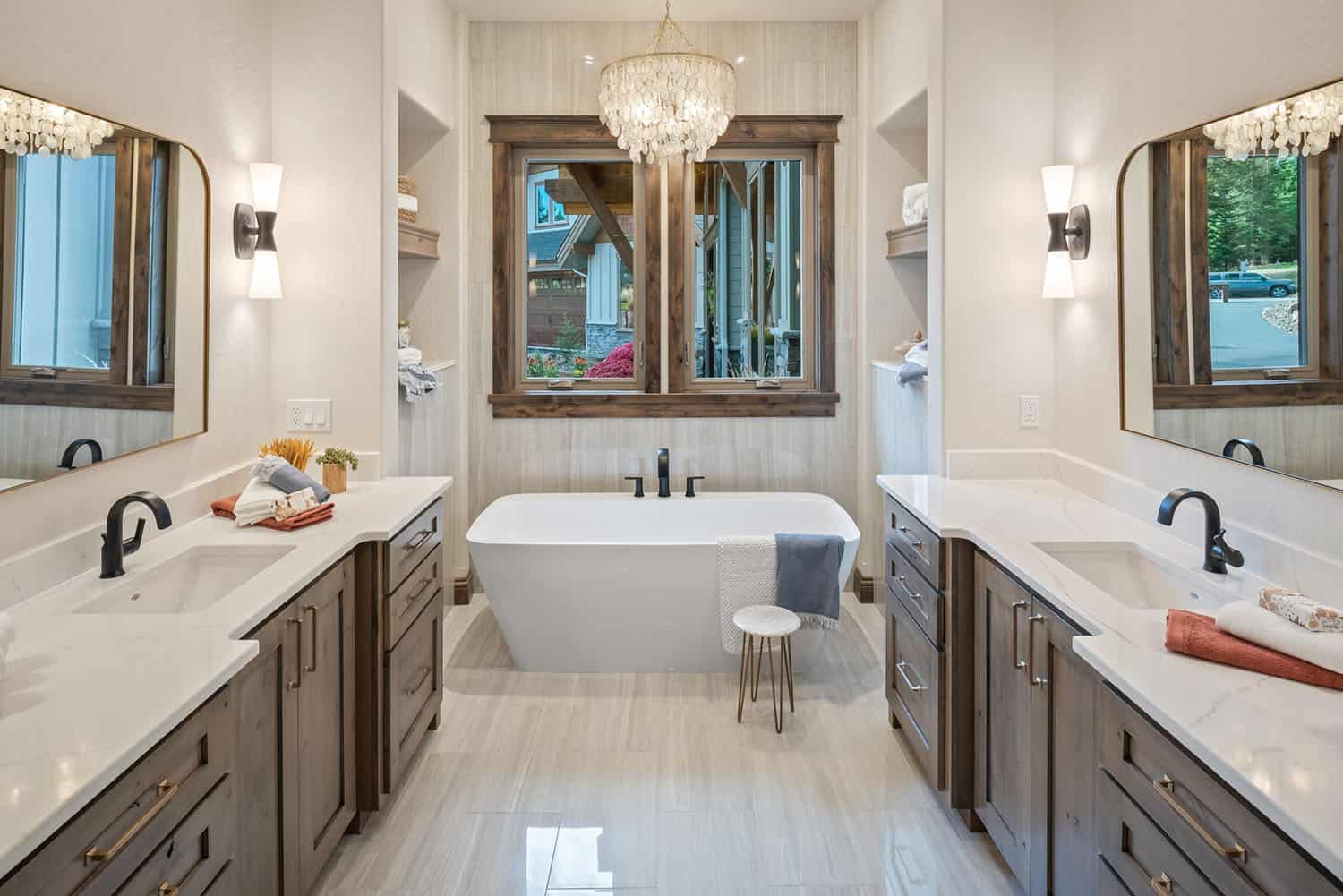 contemporary bathroom with dual vanities and a soaking tub