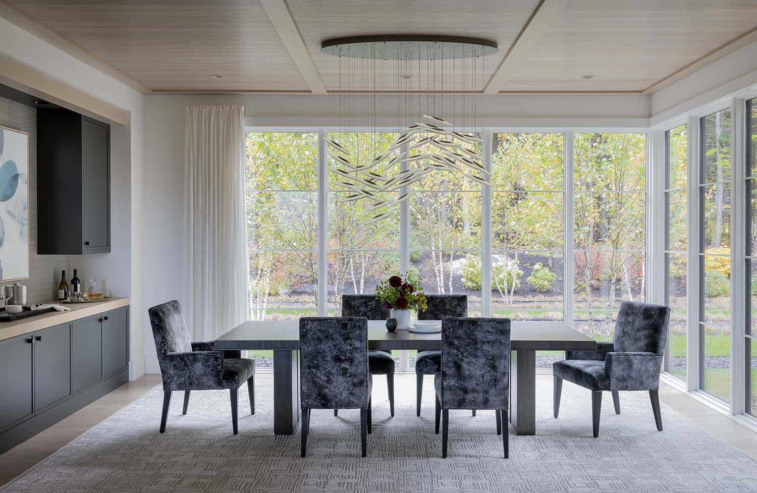 modern living room with views of river birch trees