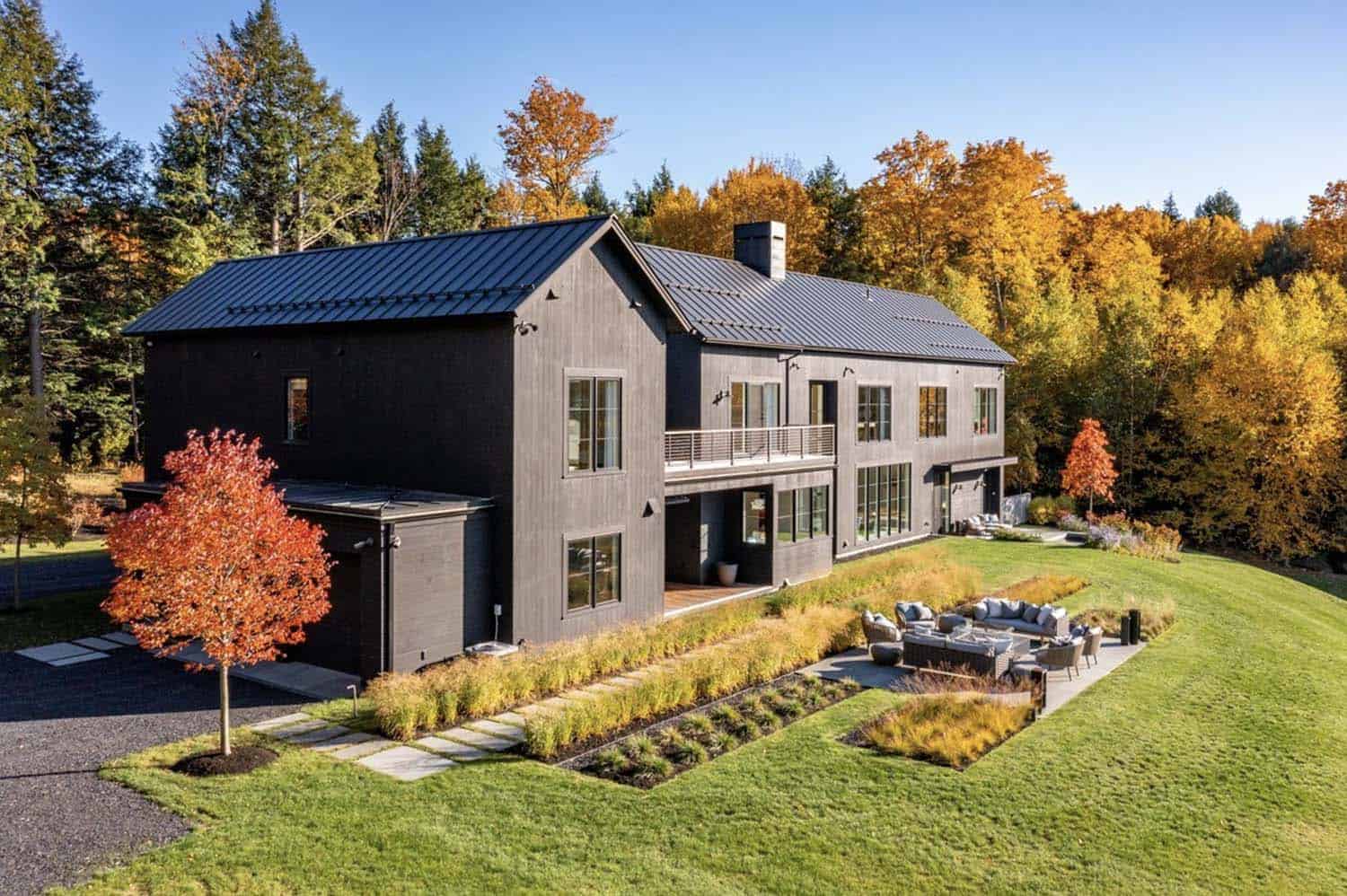 modern farmhouse inspired house exterior backyard view