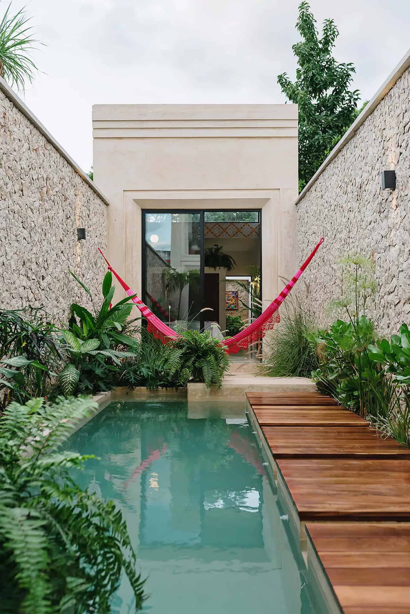 tropical small house exterior courtyard with a plunge pool