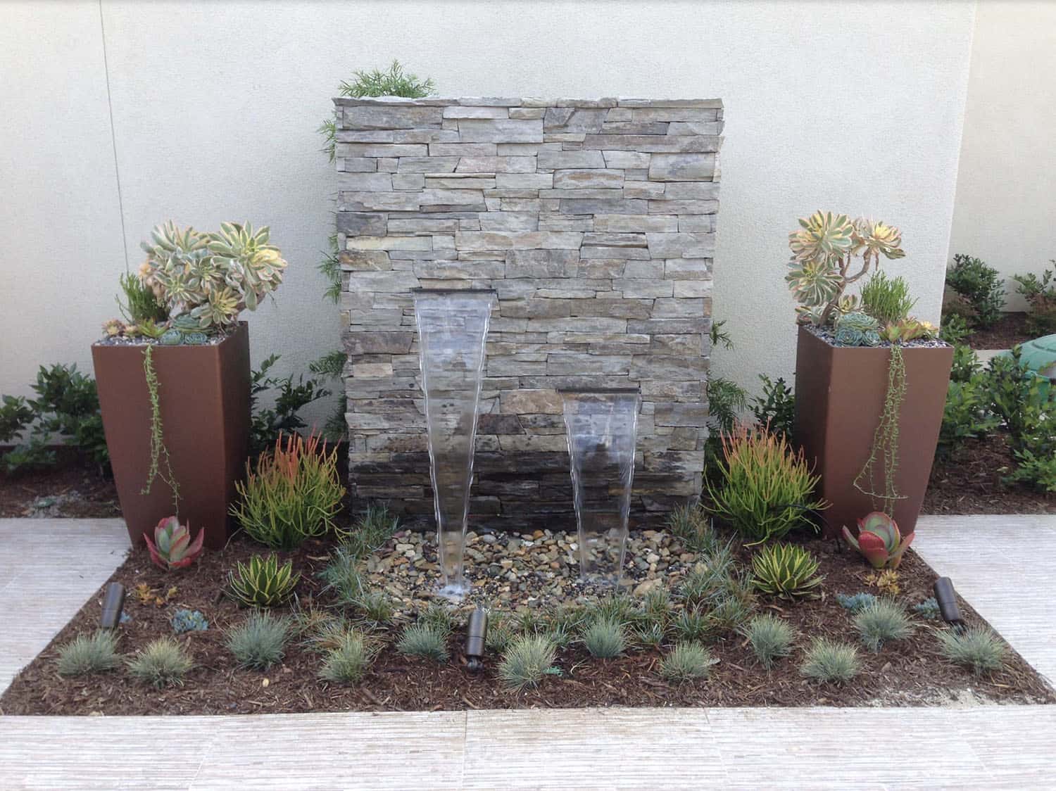 contemporary water feature with ledgestone