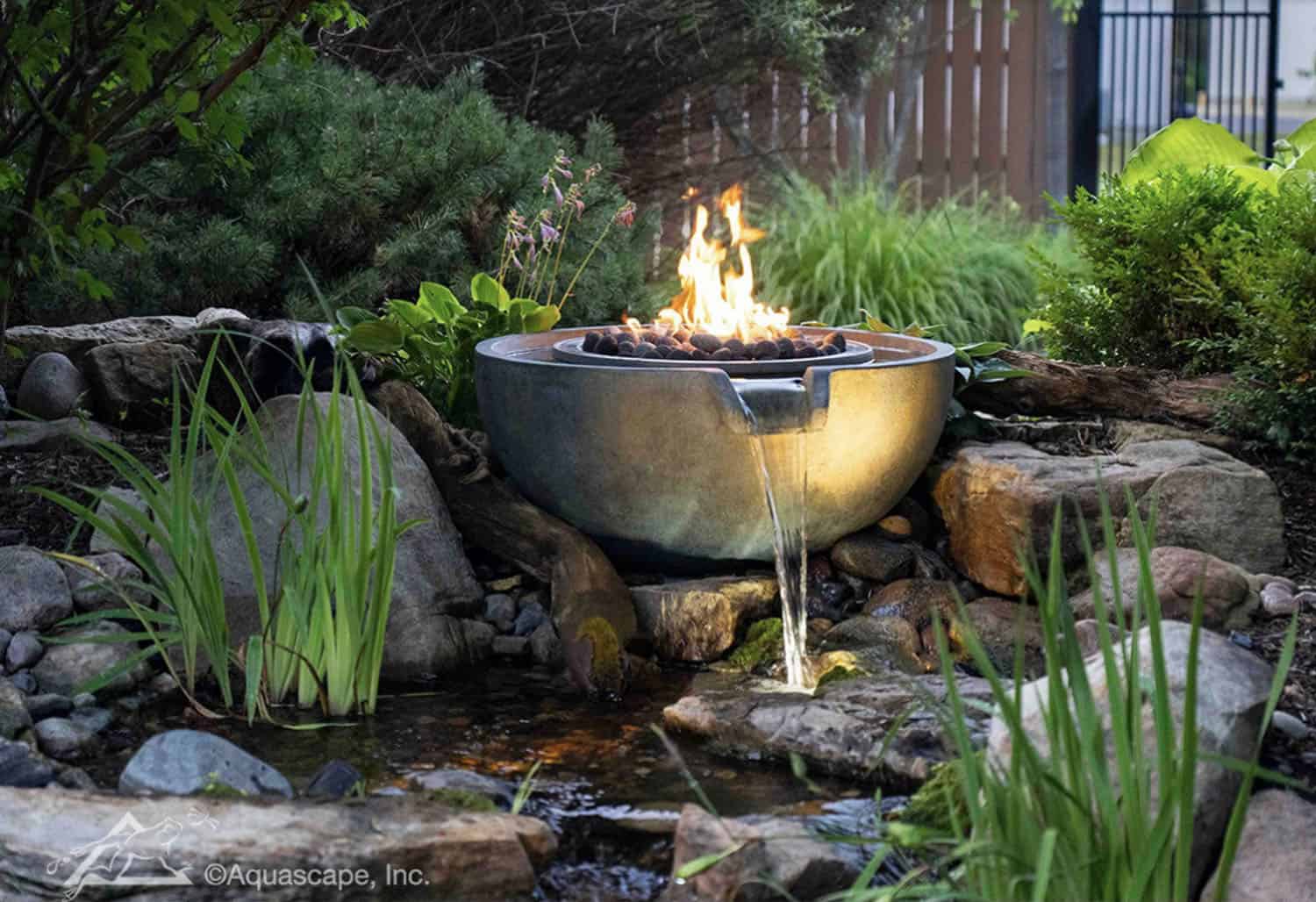 tropical landscape with a fire bowl water feature