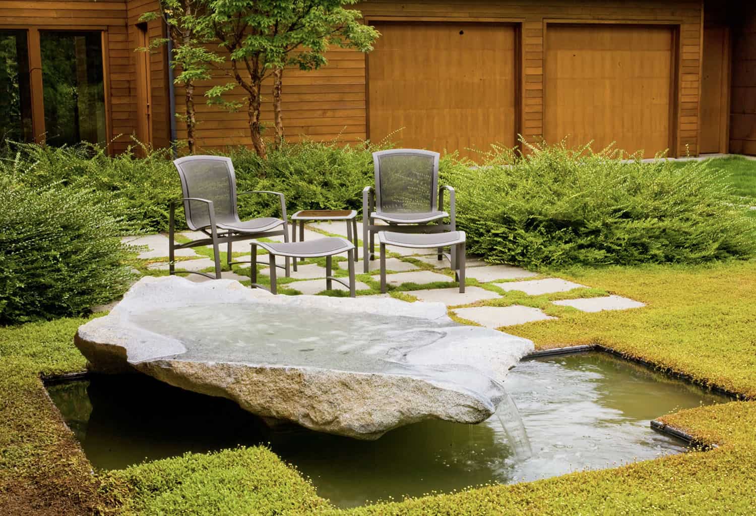 modern rock water feature in the garden