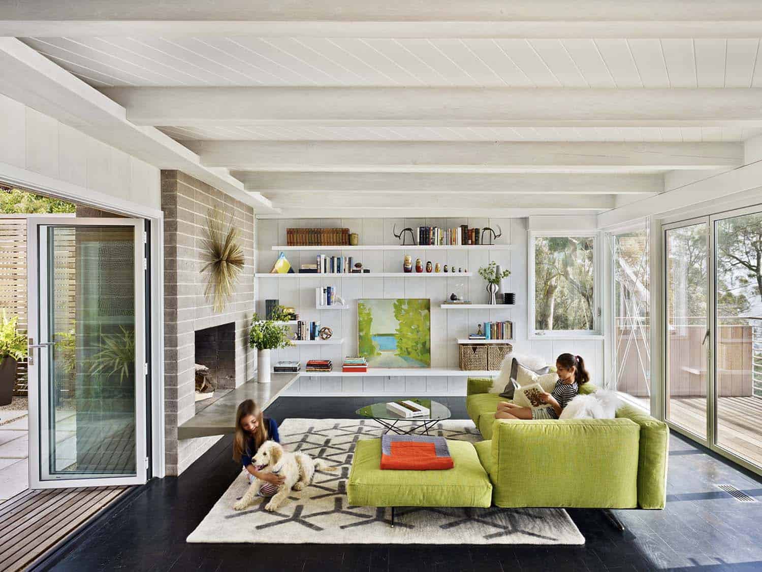 contemporary living room with a green sofa