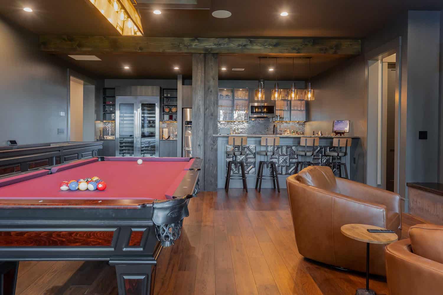 mid-century-modern-lower-level-family-room-with-a-bar-and-pool-table