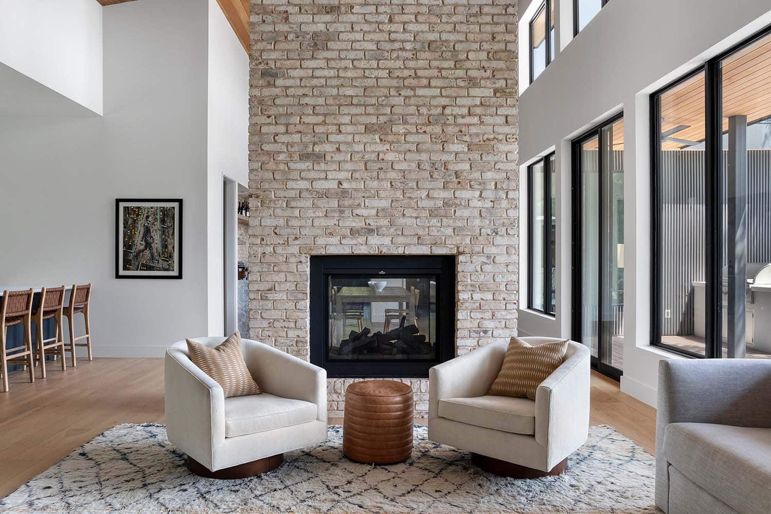 mid-century-modern-living-room-with-a-dual-sided-fireplace