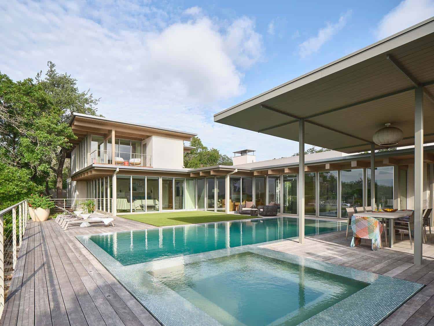 midcentury modern house exterior with a pool and spa