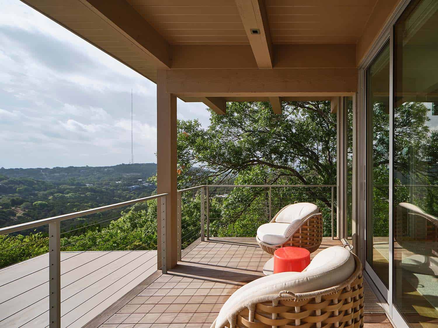 midcentury modern house exterior with a covered patio and outdoor furniture
