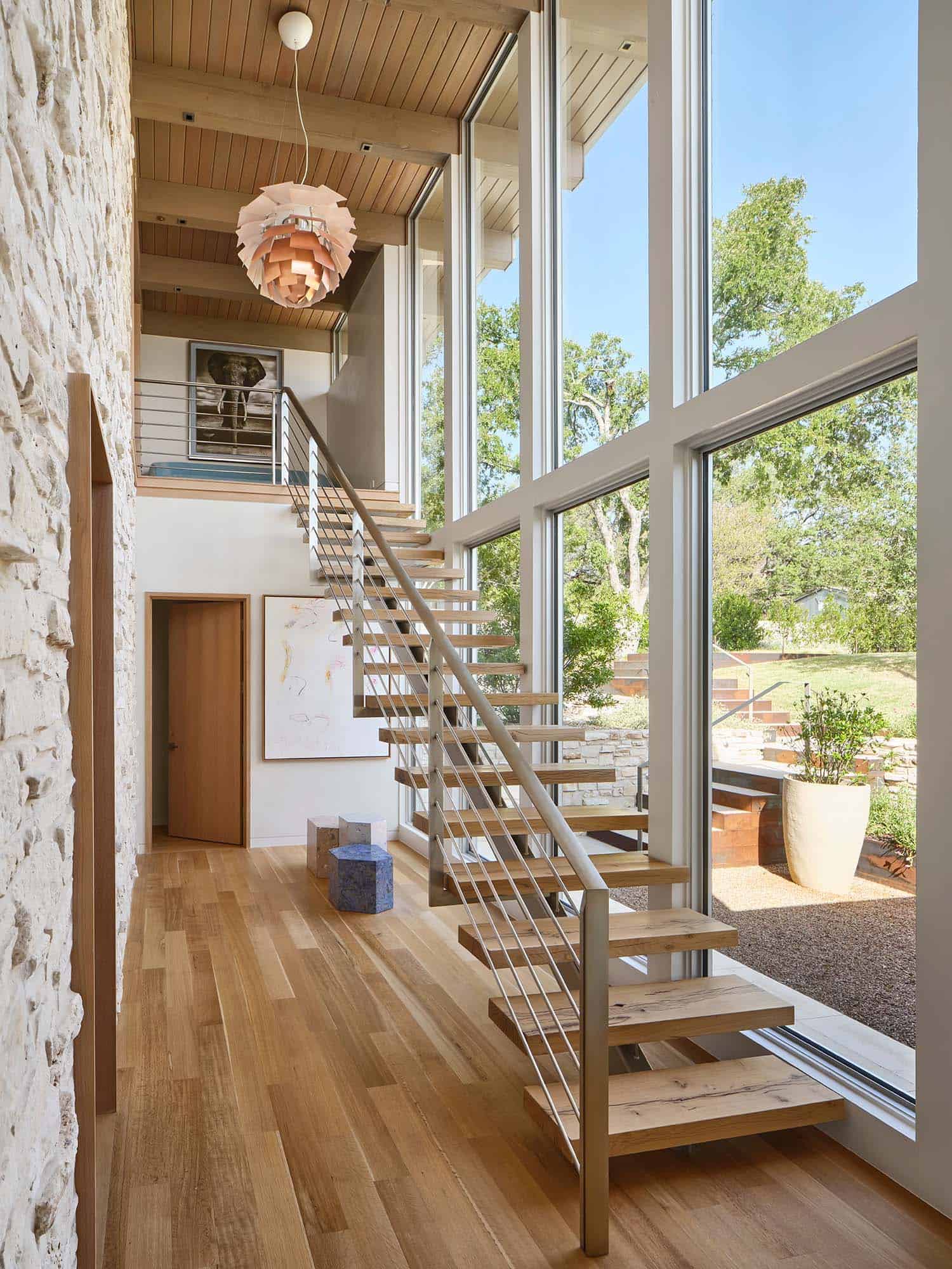 midcentury modern staircase and large windows