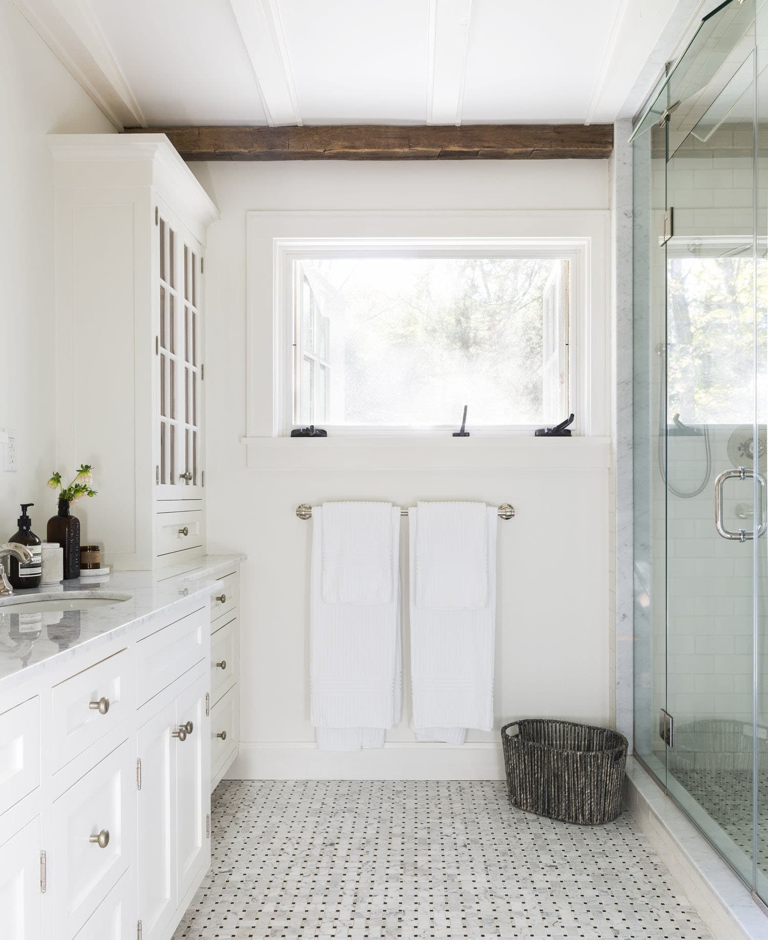 farmhouse bathroom with a glass enclosed shower and vanity