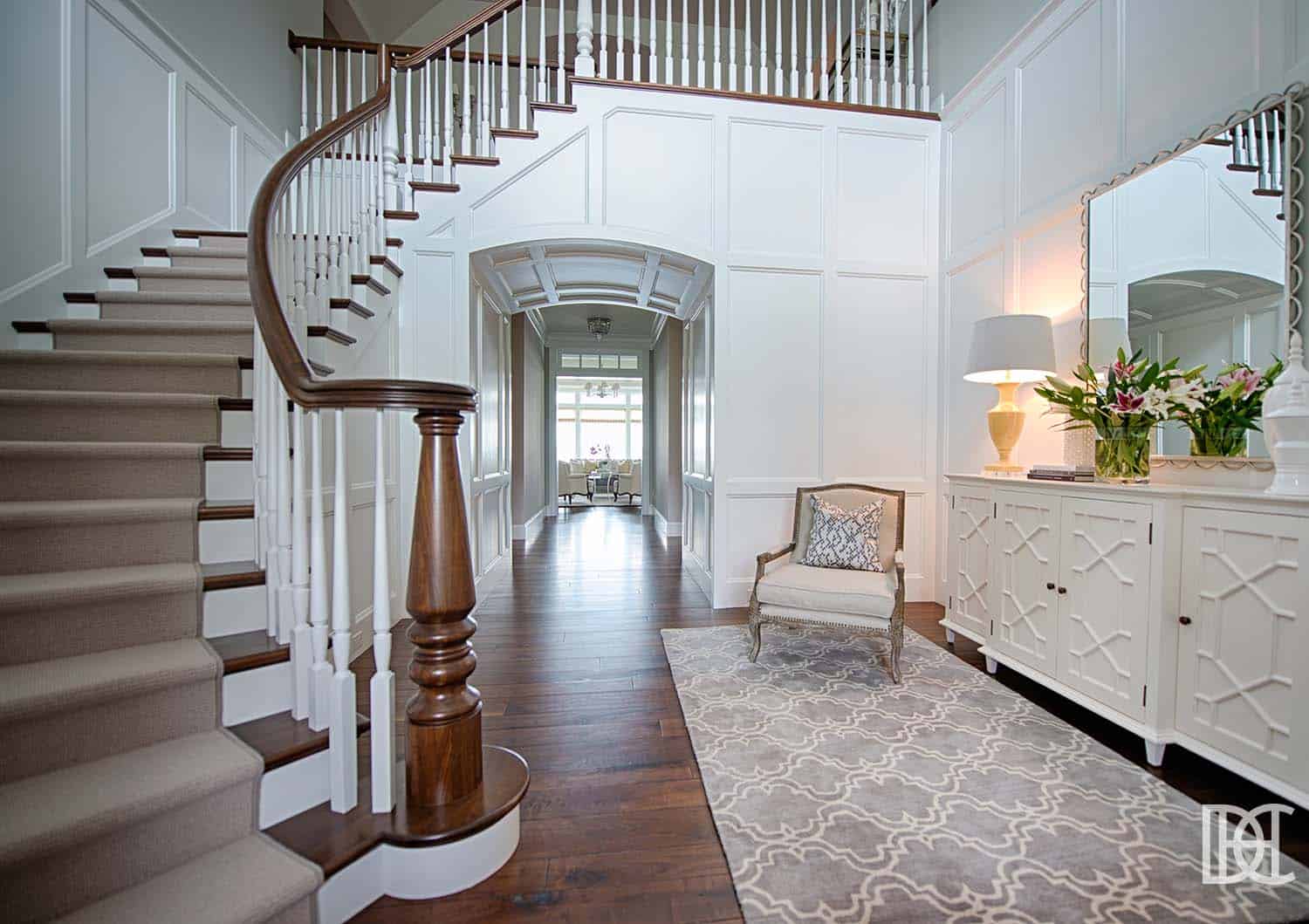 transitional style entry with a formal staircase
