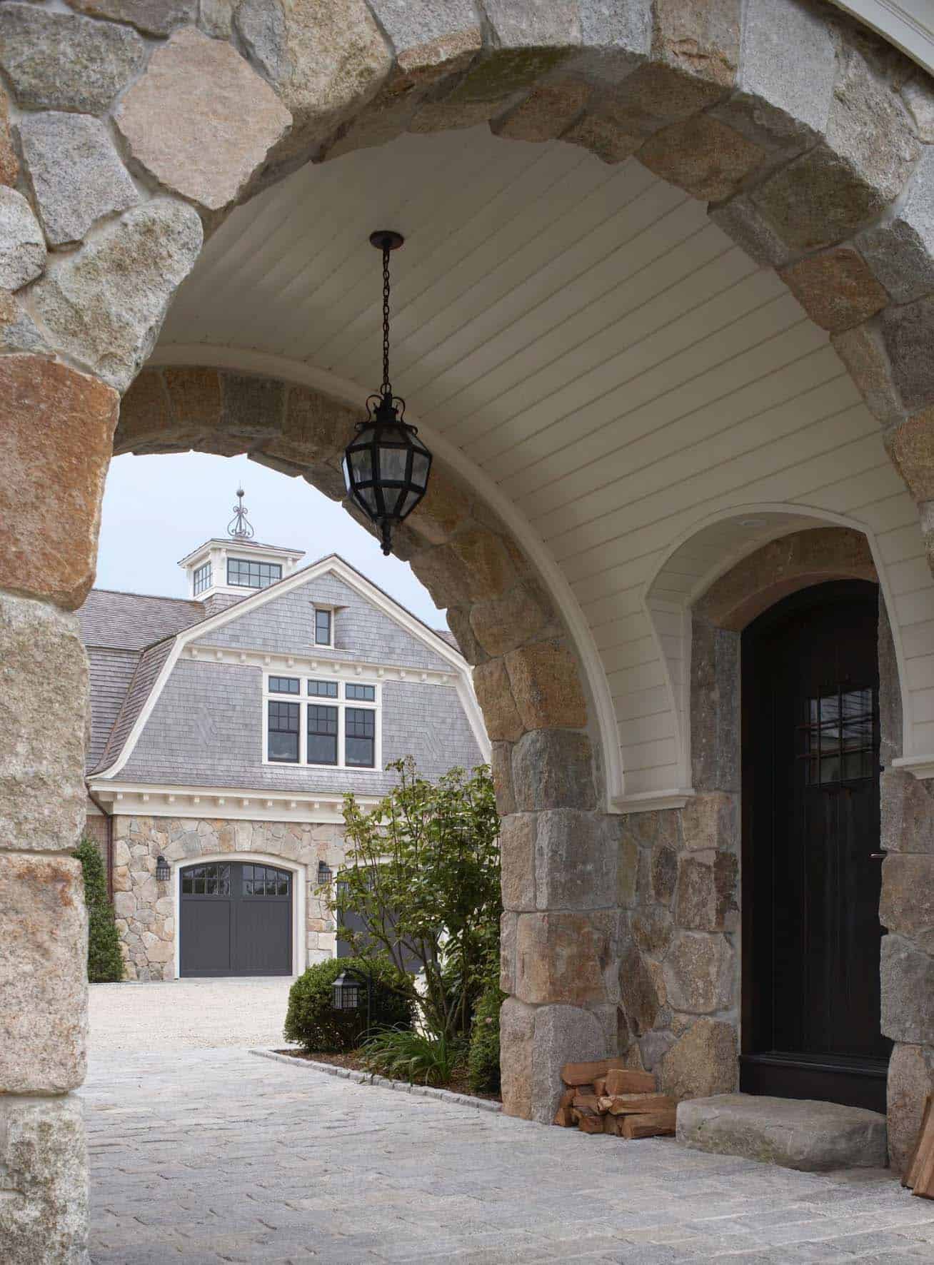 stone entry arch connects the main house and guest house