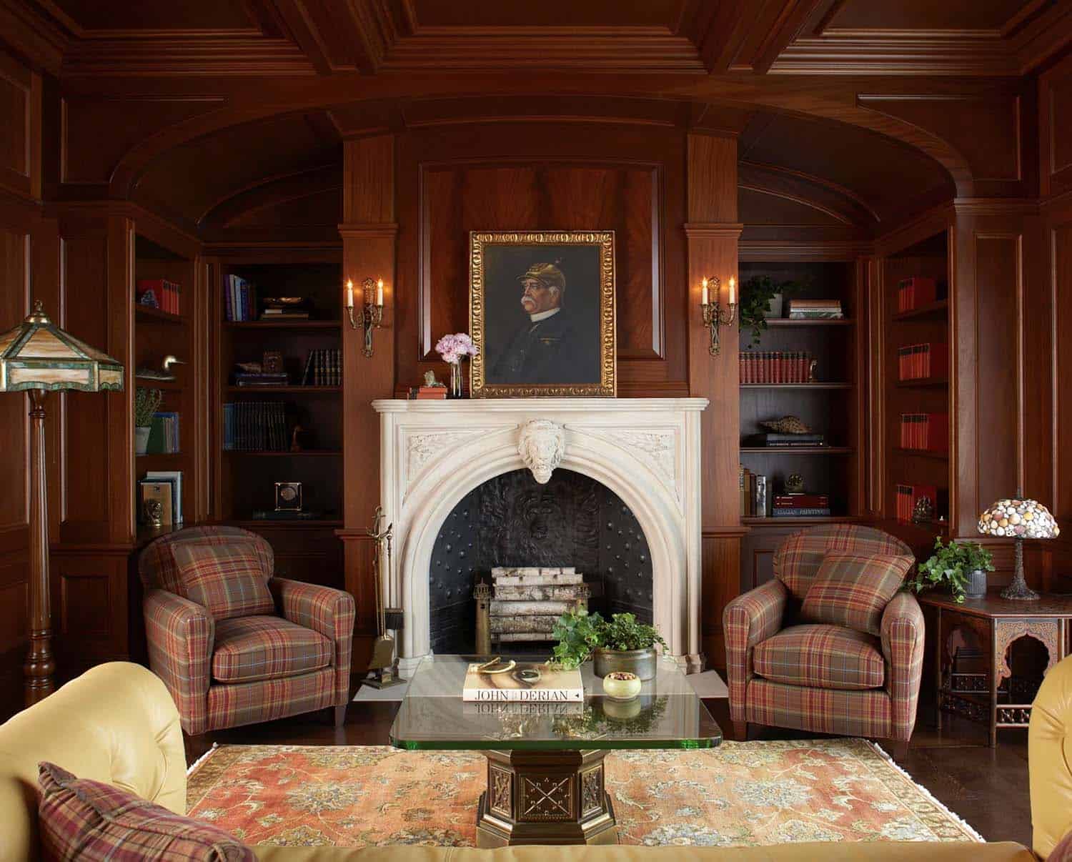 traditional style home library with a fireplace