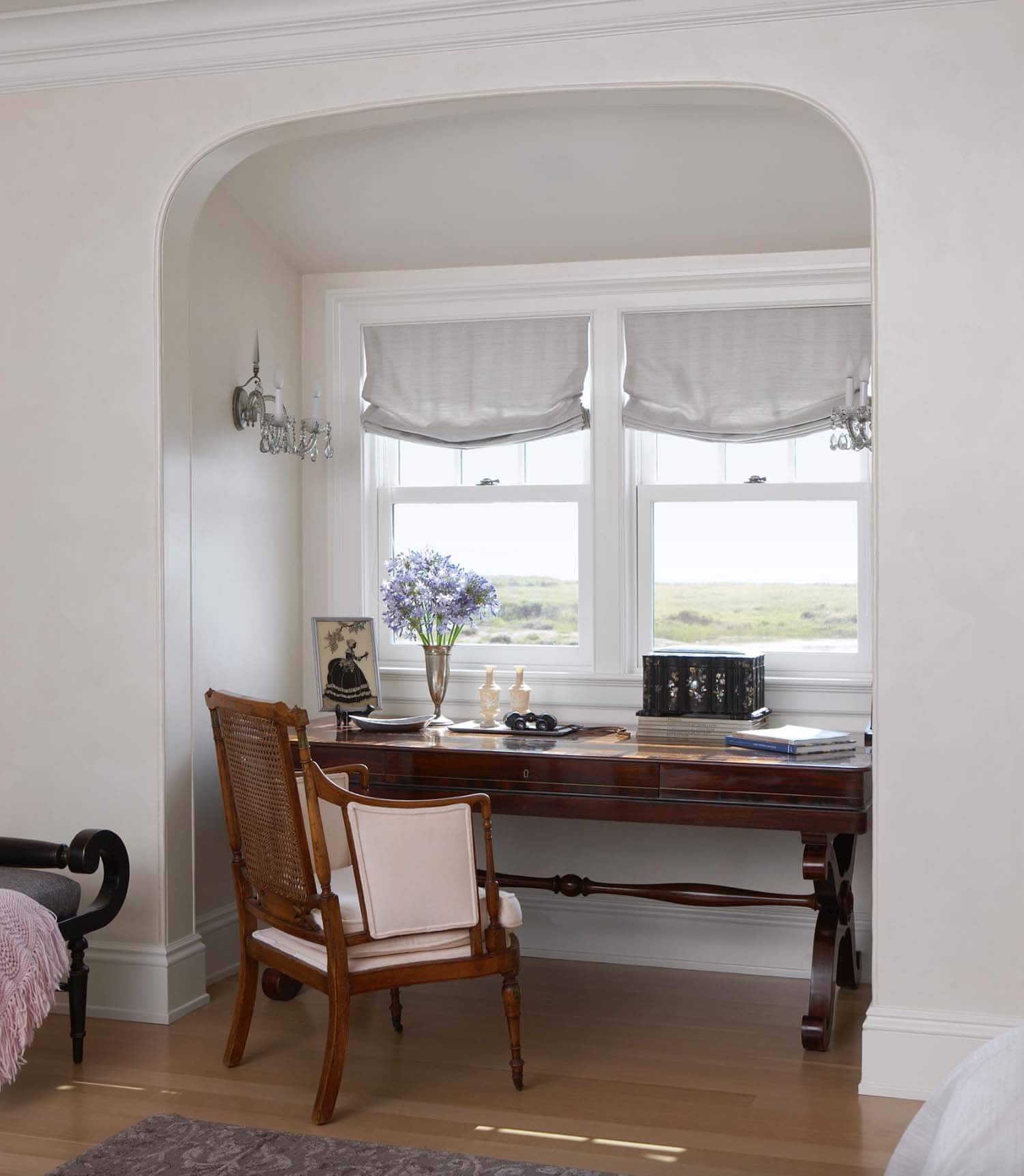 traditional style bedroom with a writers desk in the window
