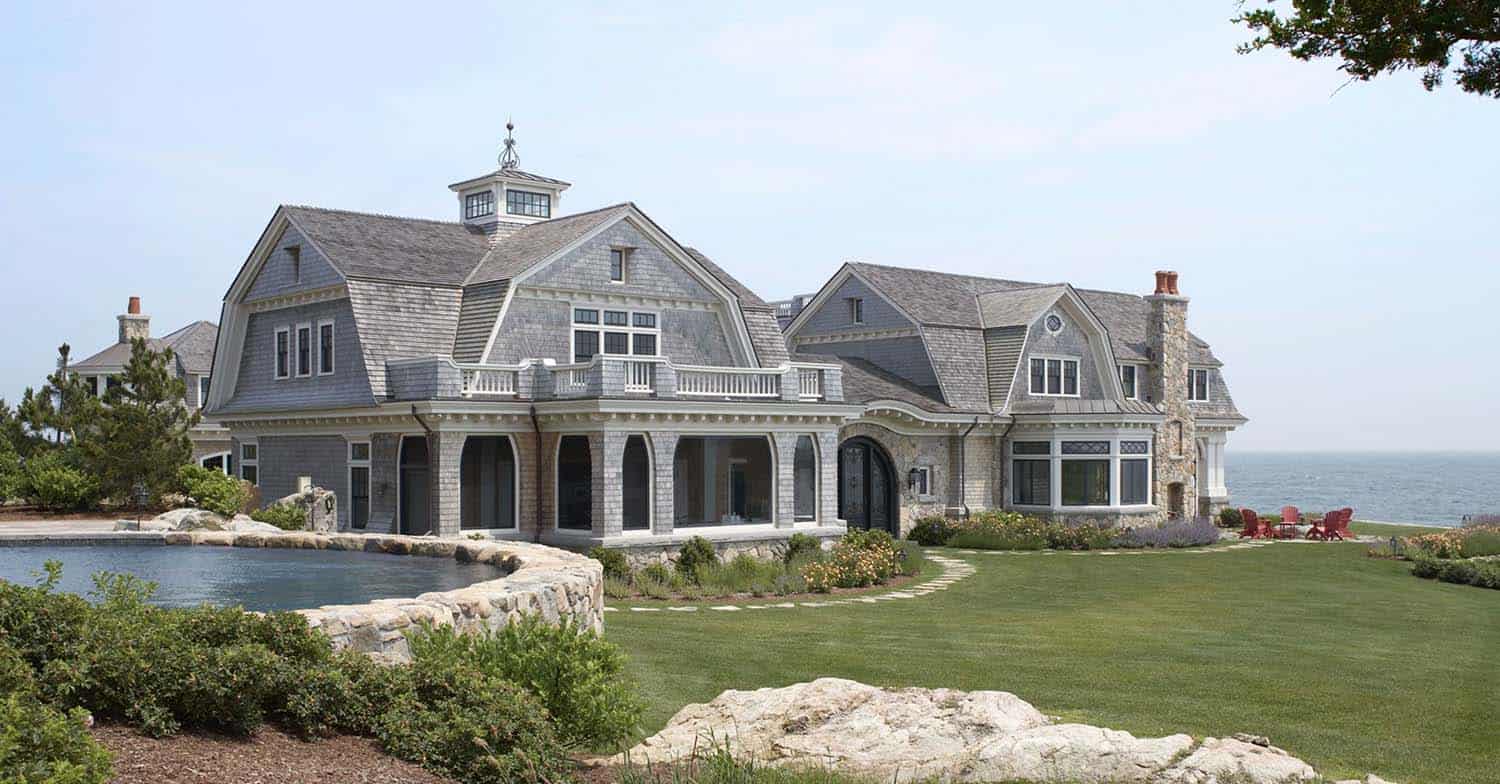 gambrel roof oceanfront home exterior with pool view