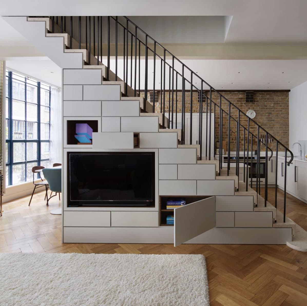 central-staircase-with-living-room-storage-and-tv