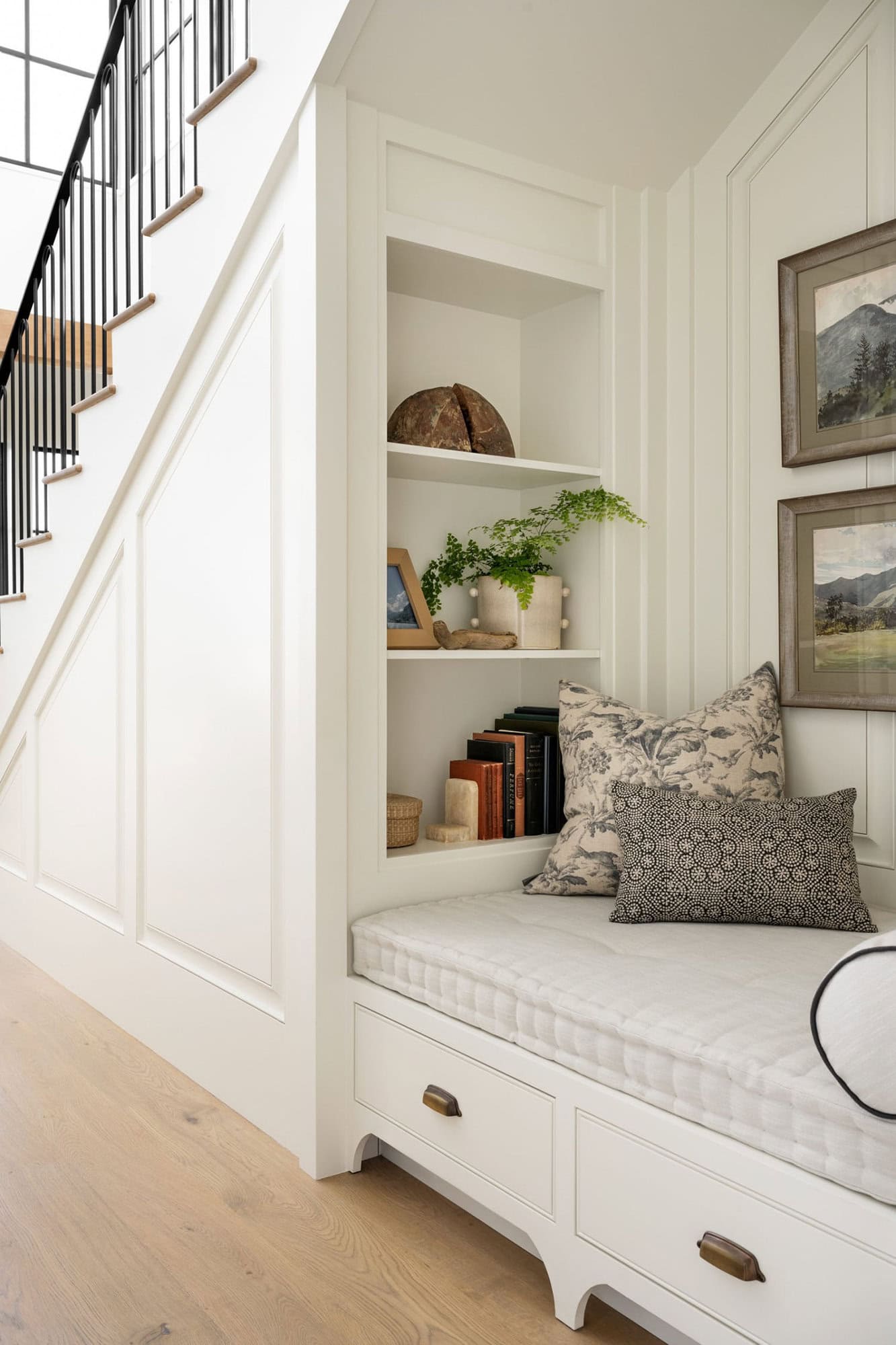 under-stairs-reading-nook-with-built-in-shelves