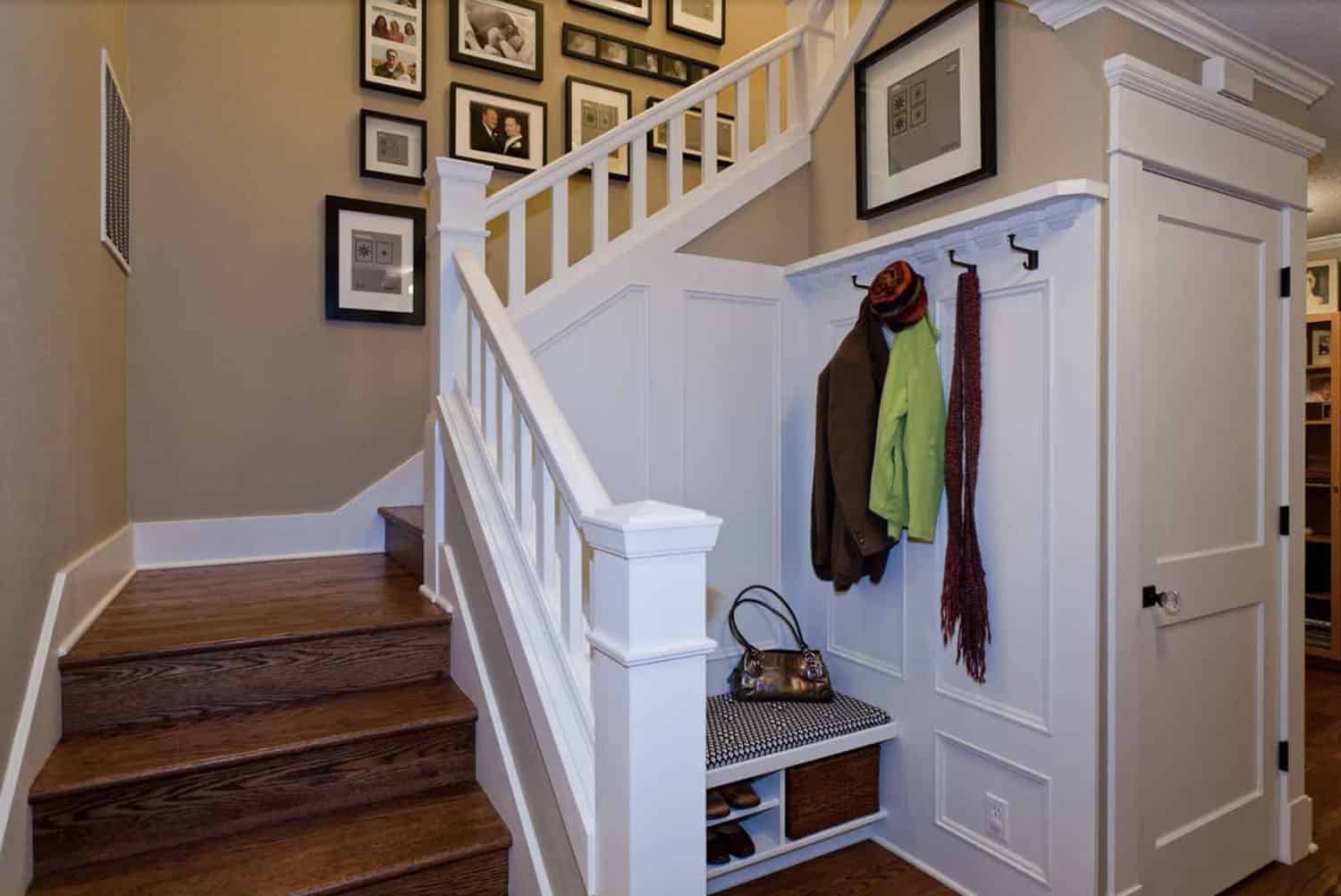 craftsman-staircase-with-a-built-in-bench-and-storage-hooks