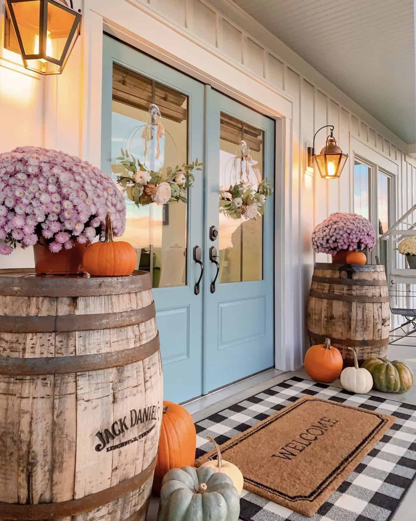 fall-dcorated-entry-with-whisky-barrels-mums-and-pumpkins