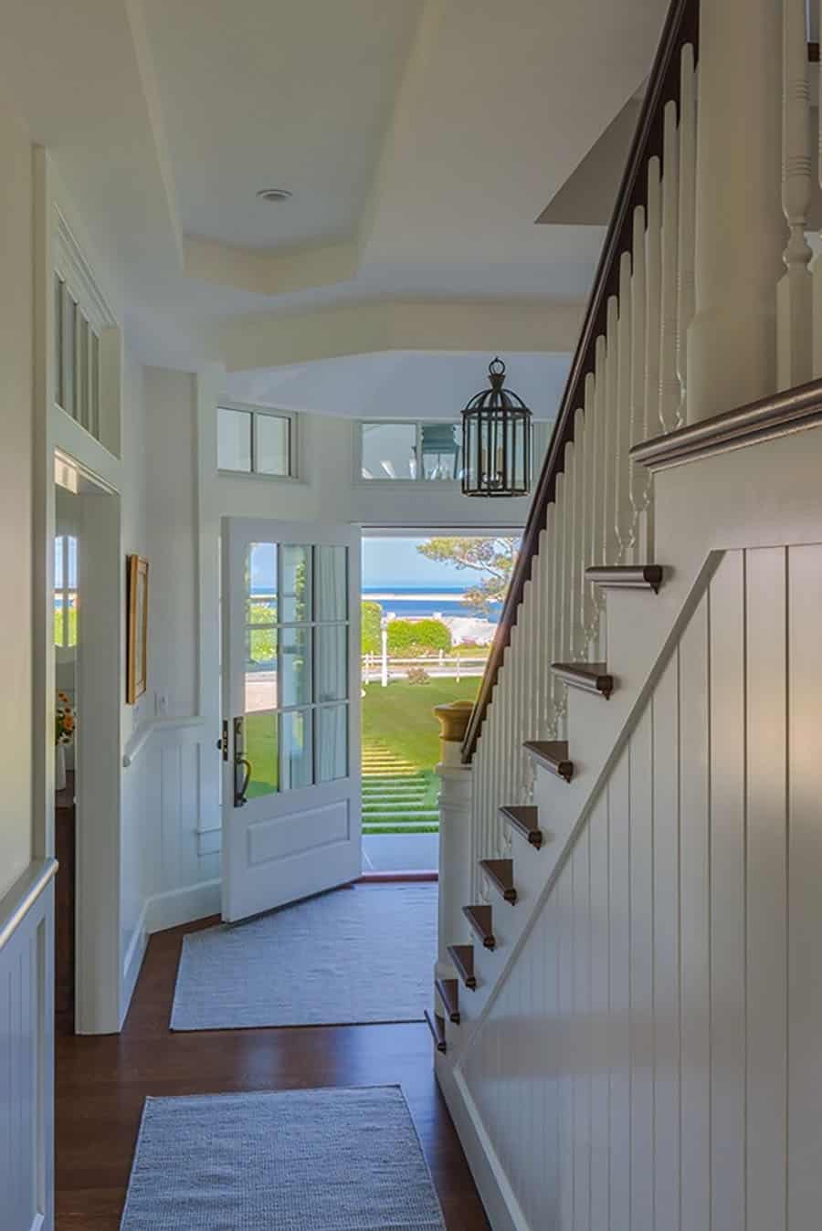 coastal-style-home-entry-with-a-staircase