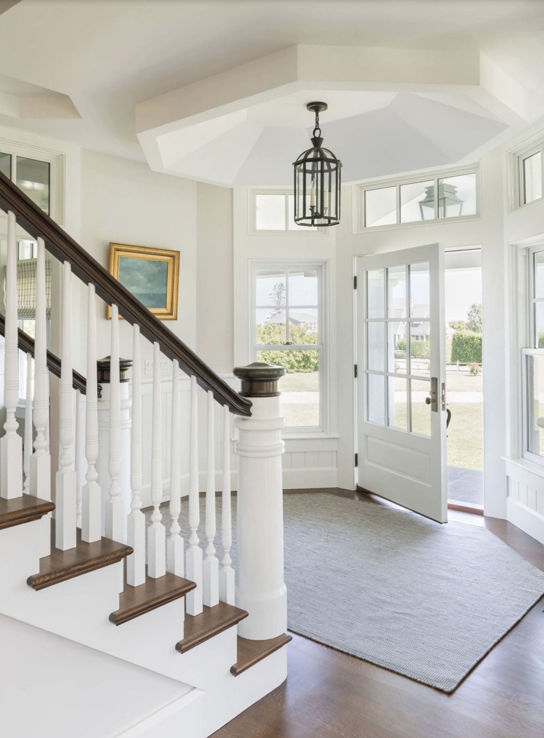 beach-style-home-entry-with-a-staircase