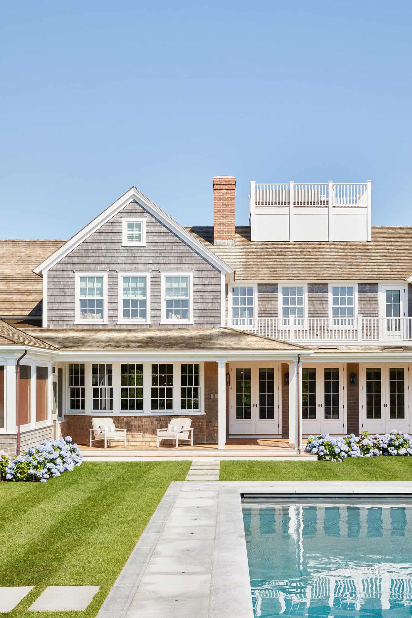 nantucket-beach-house-exterior-backyard-view-with-a-pool