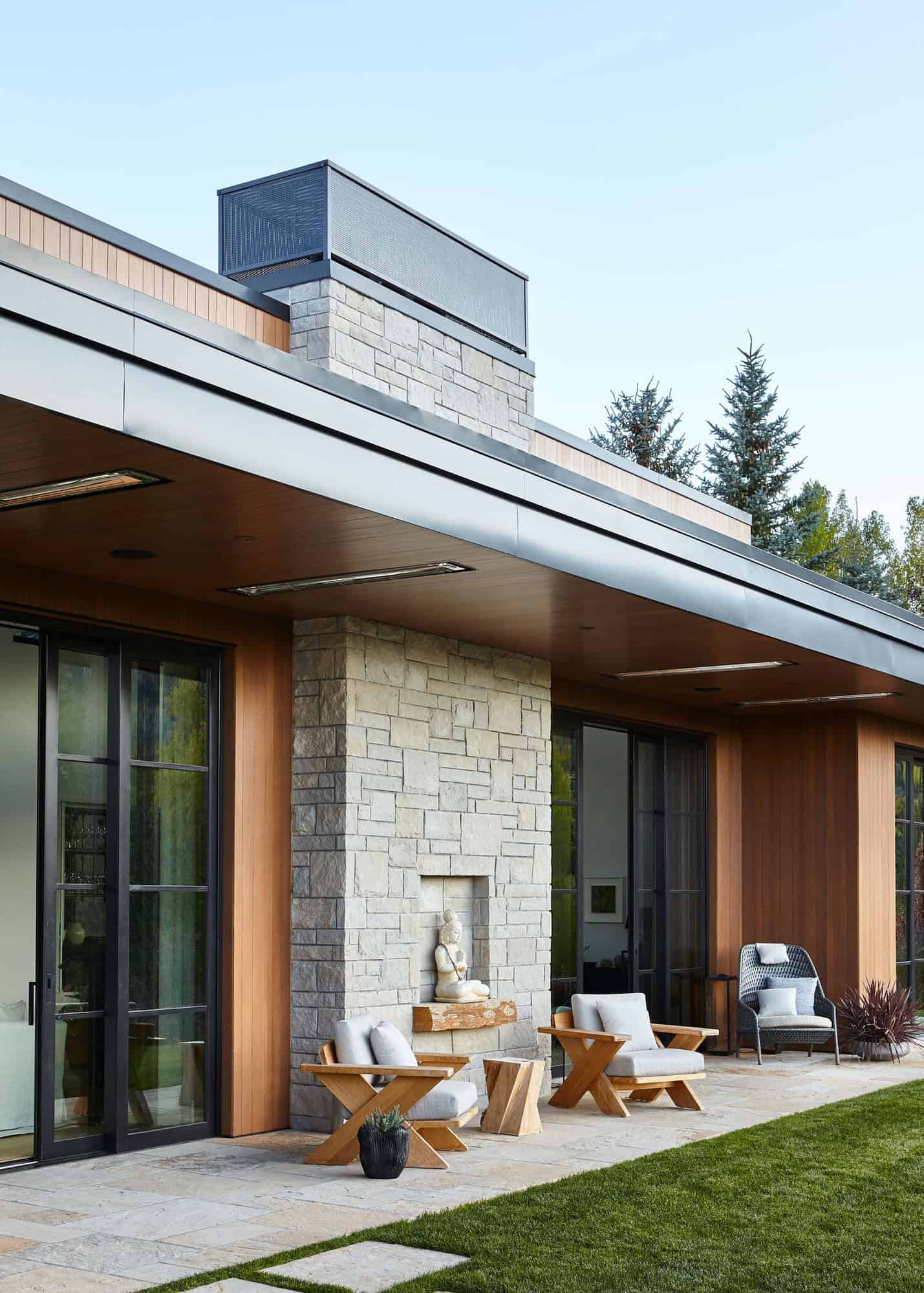 contemporary-mountain-home-exterior-patio-with-a-fireplace