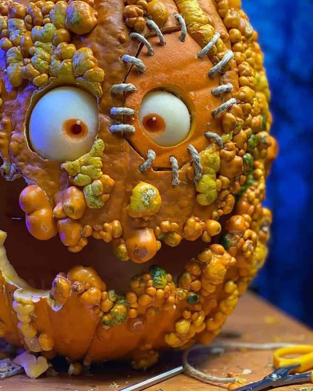 halloween pumpkin with stitching around its eye