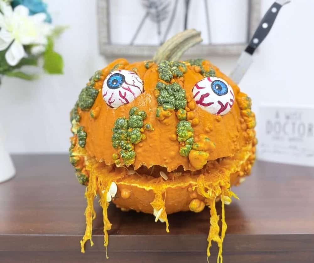 halloween pumpkin carving with crazy eyes and warts