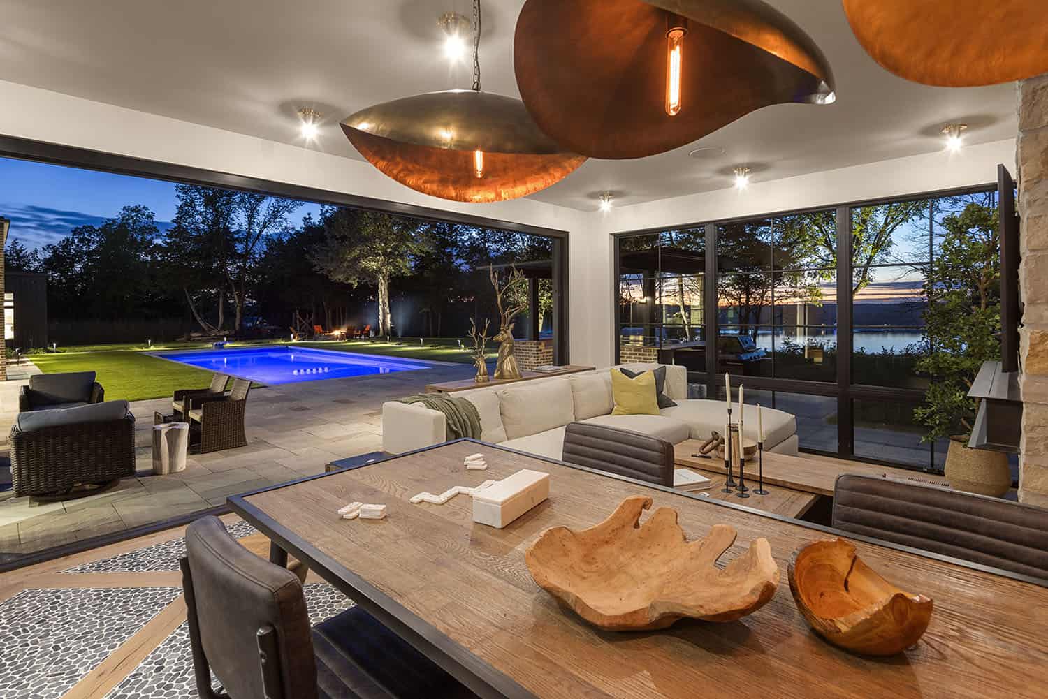 modern-lake-house-exterior-covered-patio-with-outdoor-furnishings