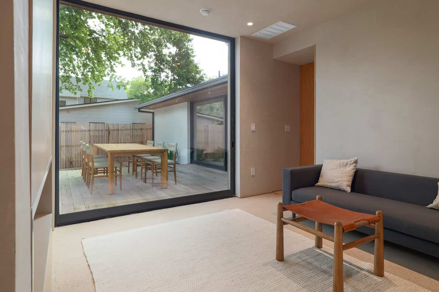 modern-bedroom-sitting-area-with-a-dual-sided-fireplace
