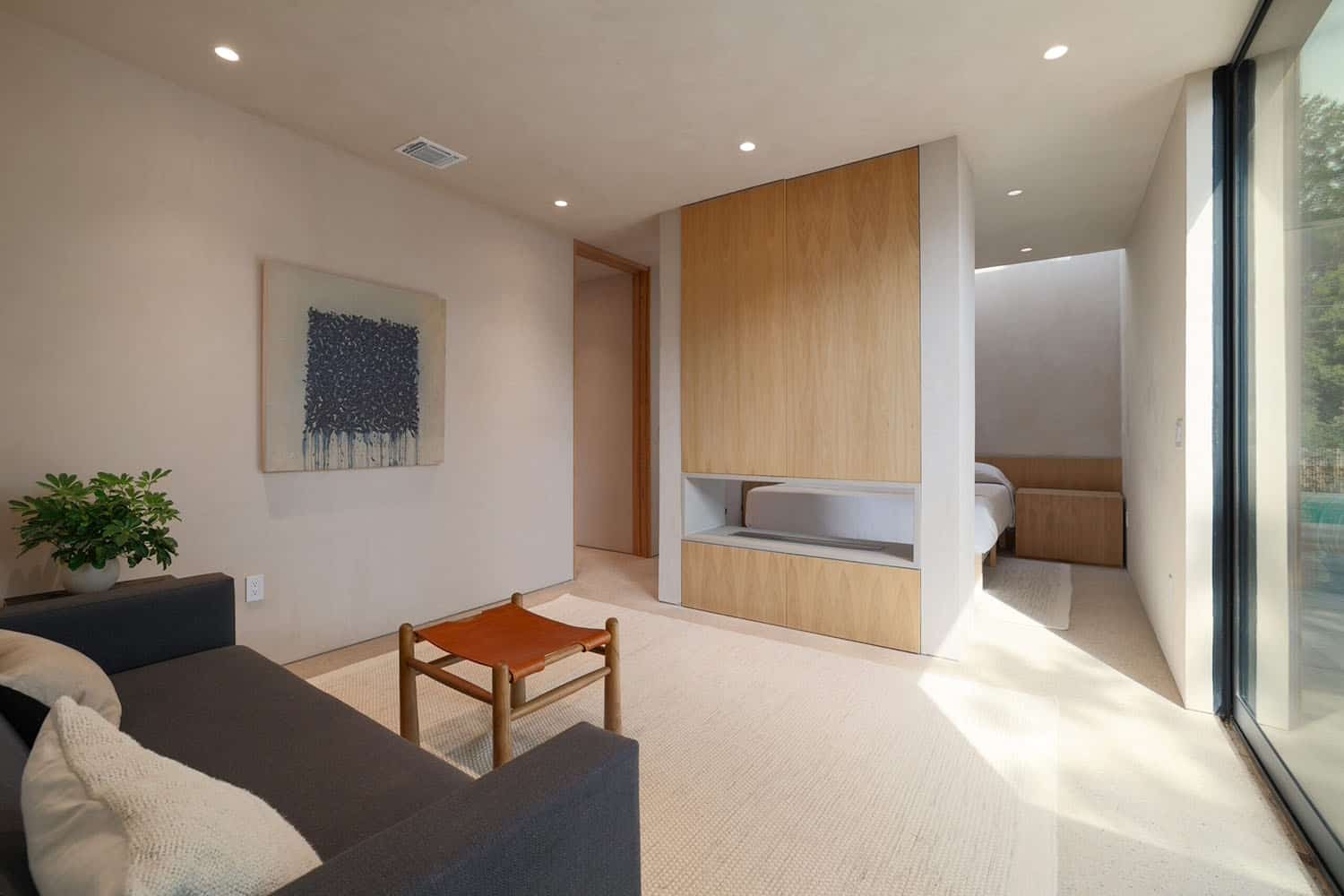 modern-bedroom-sitting-area-with-a-dual-sided-fireplace