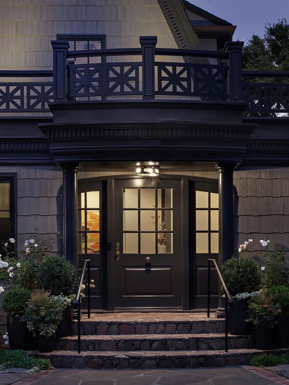 dutch-colonial-style-home-exterior-entry-at-dusk