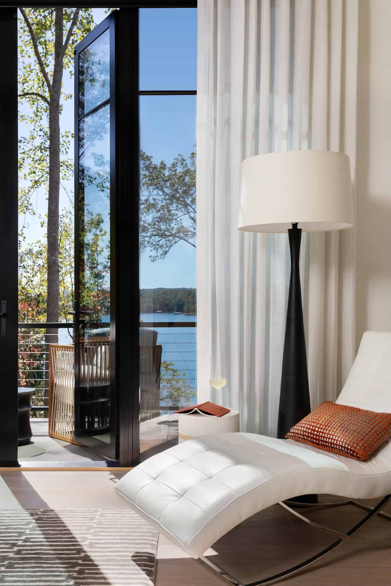 contemporary-bedroom-with-a-chaise-lounge-and-private-balcony