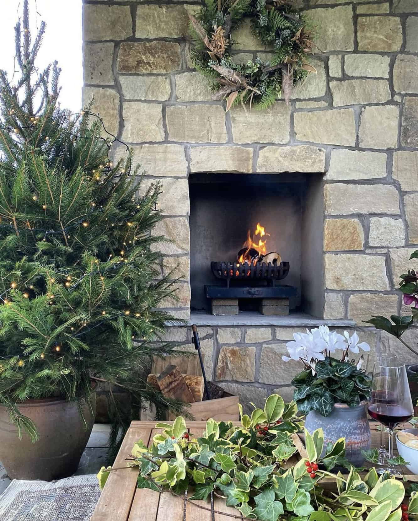 stone-fireplace-with-a-wreath-and-a-christmas-tree