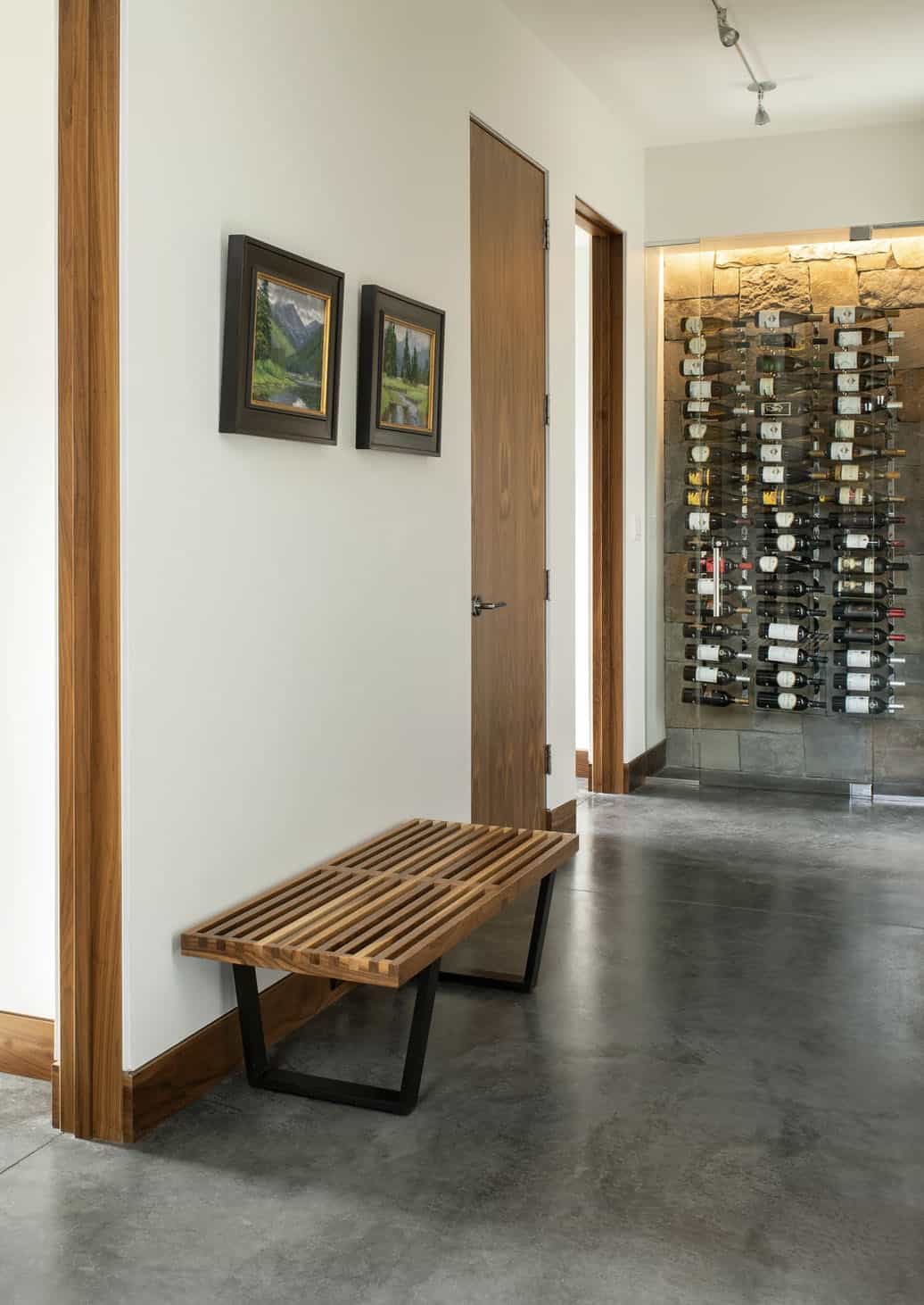 mountain-contemporary-hallway-with-a-bench-and-wine-cellar