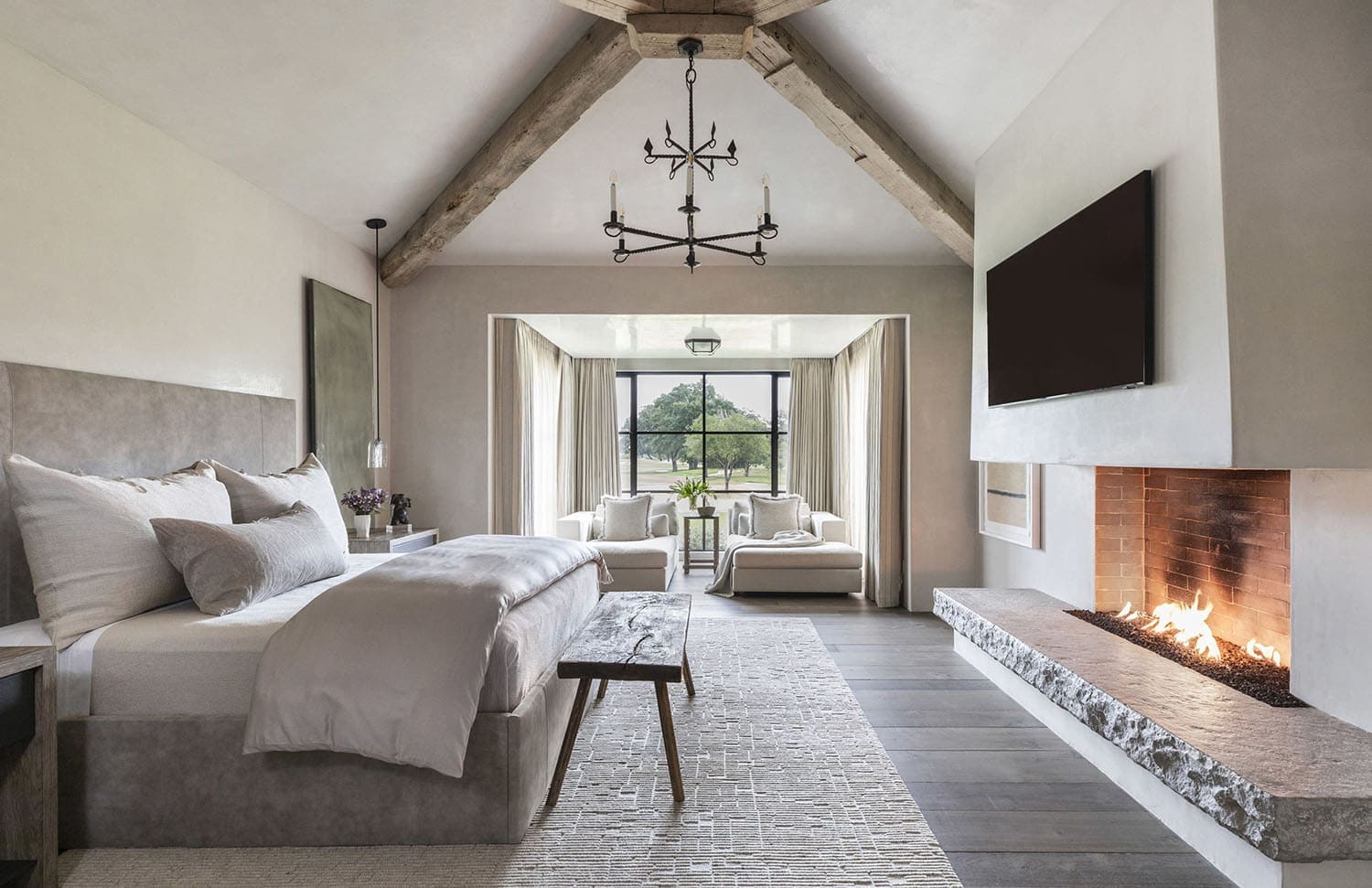 belgian-farmhouse-style-bedroom-with-a-fireplace