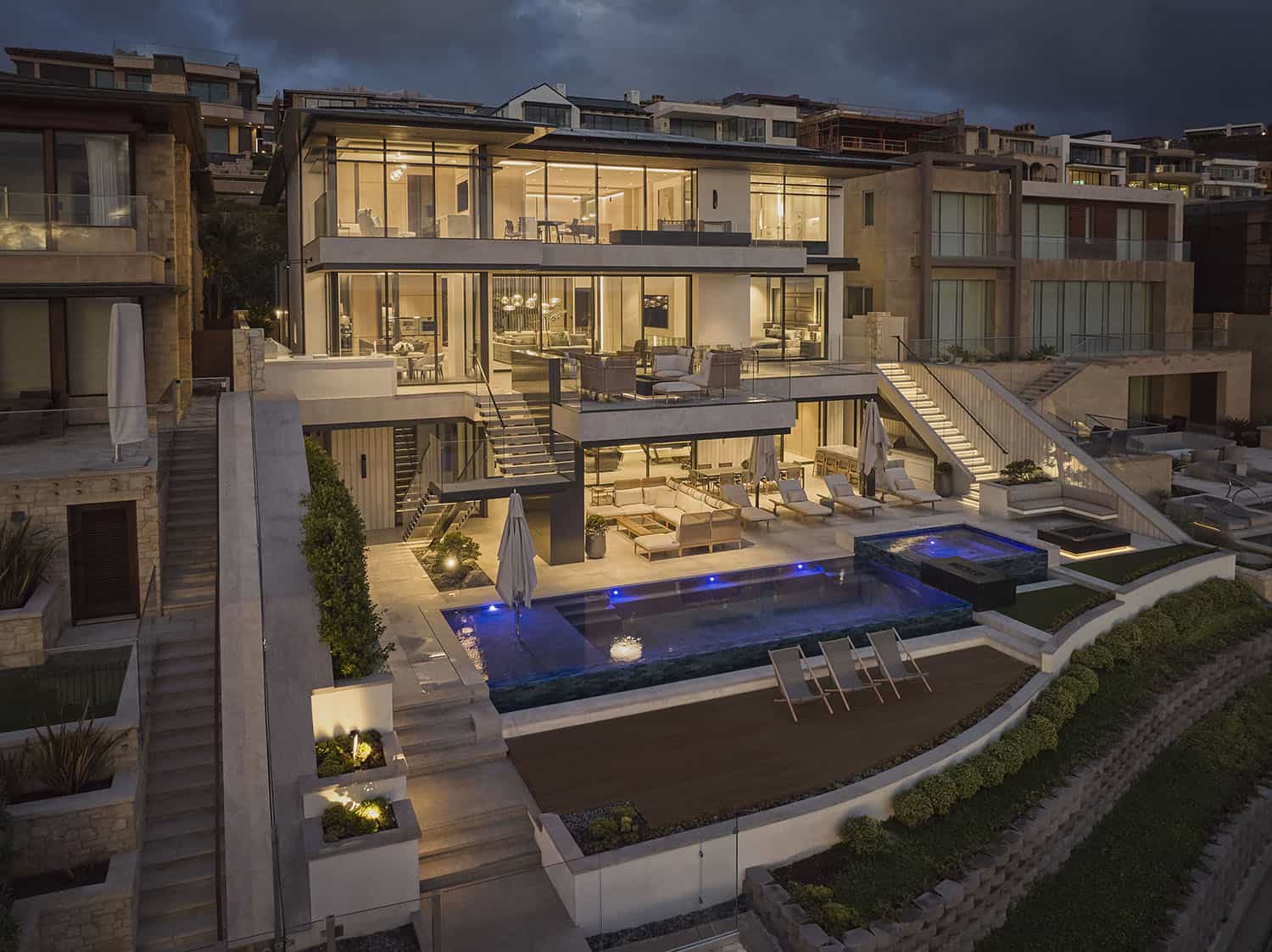 contemporary-home-exterior-with-a-pool-at-dusk